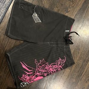 Men’s O’Neill board shorts. Black/pink. Waist size 36.
